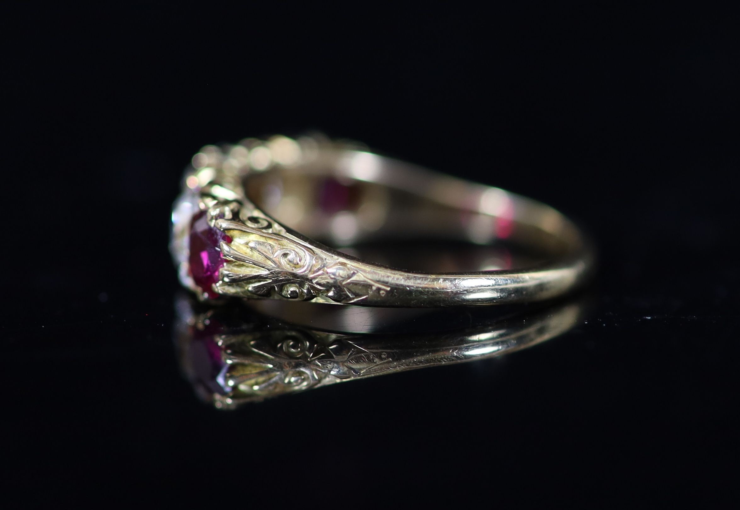 A Victorian style gold, three stone ruby and two stone diamond set half hoop ring